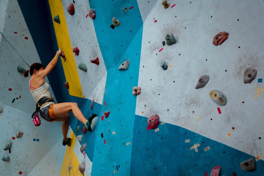 image of person indoor rock climbing